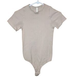 The group Babaton Aritzia Tan Ribbed Seamless Teee Short Sleeve Bodysuit Medium